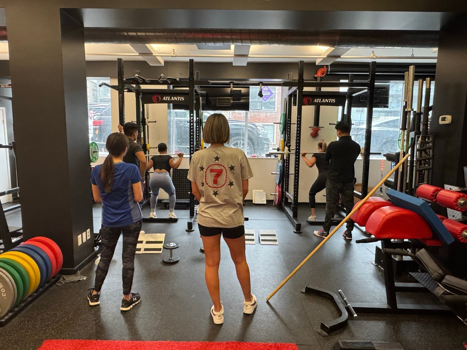 Industrial gym interior with weight training equipment and red flooring at Arzadon Fitness Toronto