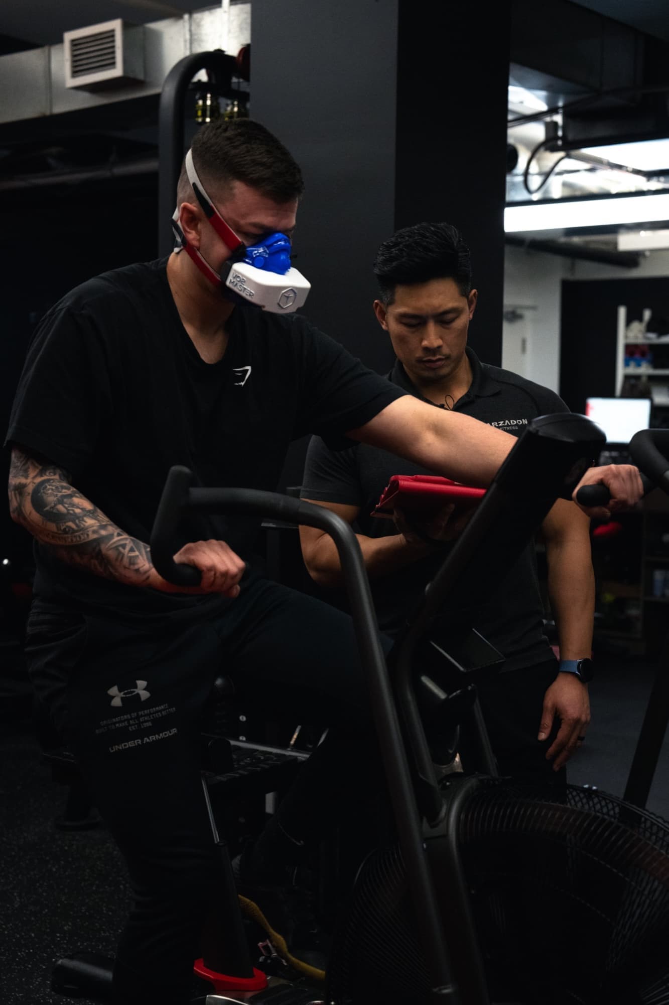 Client wears VO2 Master mask during stationary bike test — clinical-grade aerobic assessment at Arzadon Fitness Toronto